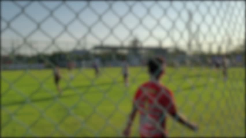 4K slow motion video footage. Blurry video of people playing sports football or soccer
