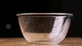 Chocolate cookies fell into a large glass bowl, slow motion - Powered by Shutterstock - Get 15% off with code: PIKWIZARD15