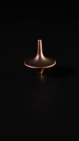 A spinning top gradually loses balance