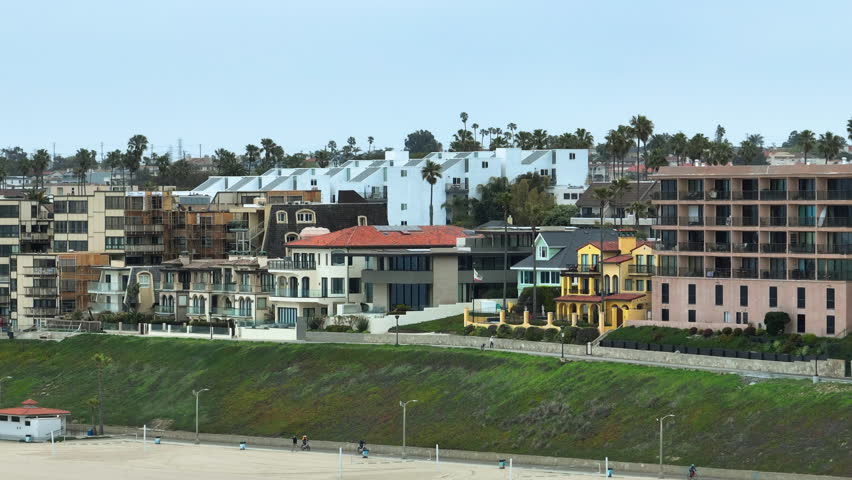 Telephoto drone shot of seaside homes at the Redondo beach, in Los Angeles, USA
