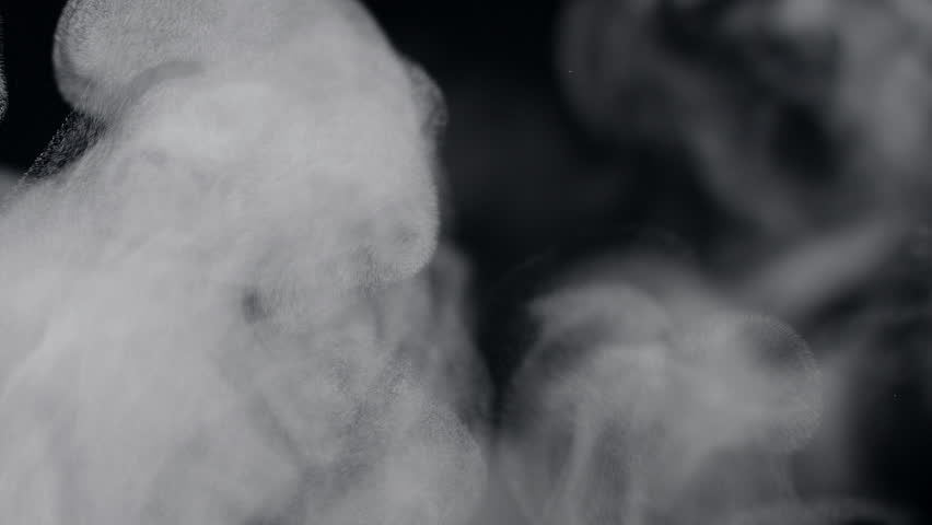 White natural rising steam from food or hot drink isolated on a black background. Сan be used in any projects with hot food. 