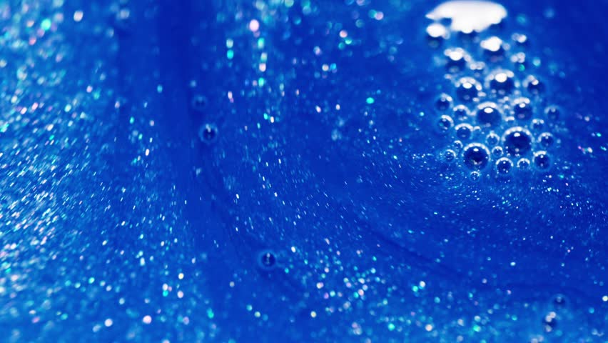 Close up view at bubbles and galactic style blue motion of Abstract and colorful ink, effervescent circles