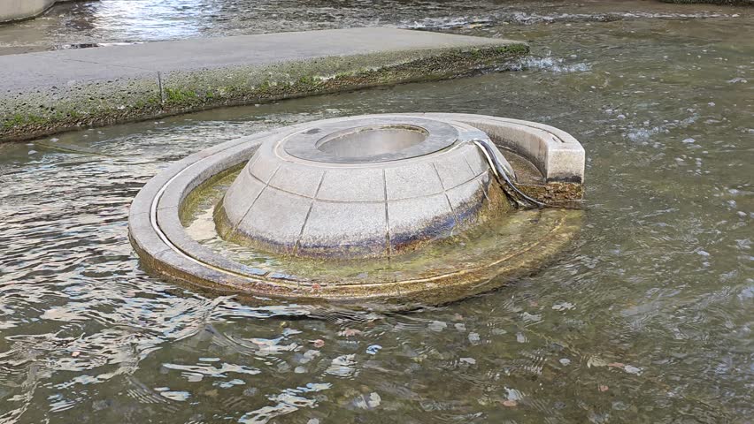 Wishing Fountain with Coins Resting Underwater