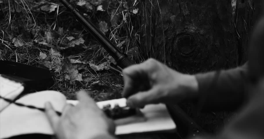 Historical Re-enactment Black And White Video. Russian Soviet Infantry Red Army Soldier In World War II using Russian Soviet Portable Radio Transceiver In Trench Entrenchment In Spring Autumn Forest