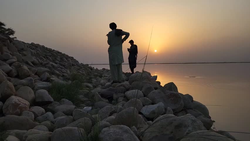 Sunset on the Rocky Shore – 4K Slow Motion Clip