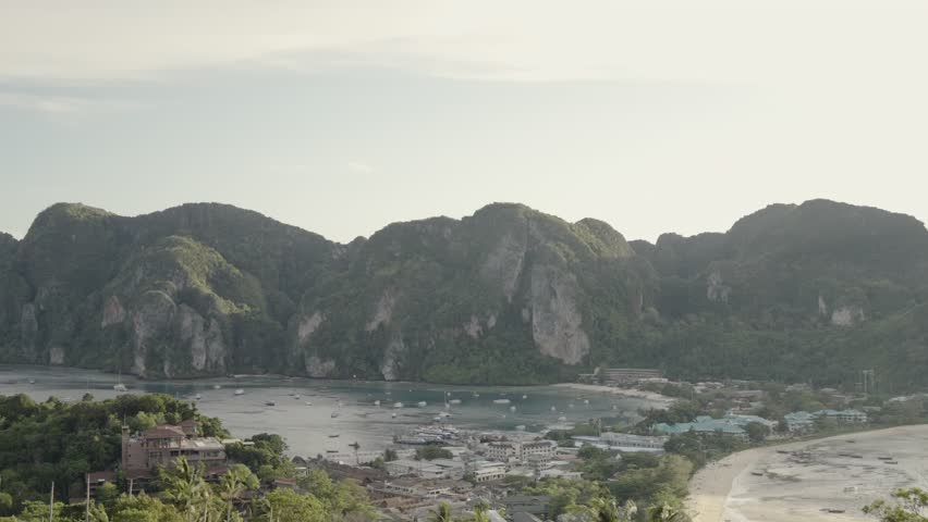 Peaceful mountain and bay view of Phi Phi island captured during golden hour in Thailand.