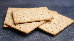 Crispy and Delicious Whole Grain Crackers Served on a Dark Background - Powered by Shutterstock - Get 15% off with code: PIKWIZARD15
