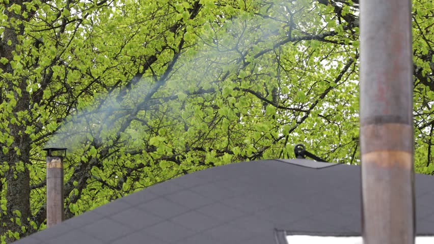 Stockholm, Sweden Smoke emerges from a small chimney attached to a traditional wood-burning portable sauna. 
