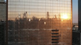 Setting sun and building reflected in glass skyscraper in New York City, NY, US. - Powered by Shutterstock - Get 15% off with code: PIKWIZARD15