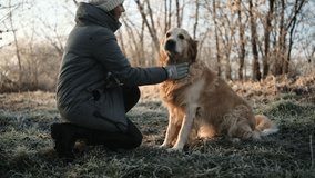Girl Walks With Adorable Golden Retriever Dog On A Frosty Morning, Dog Gives A Paw - Powered by Shutterstock - Get 15% off with code: PIKWIZARD15