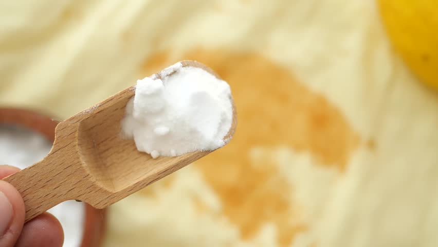 Baking soda on a shirt stain by ink 