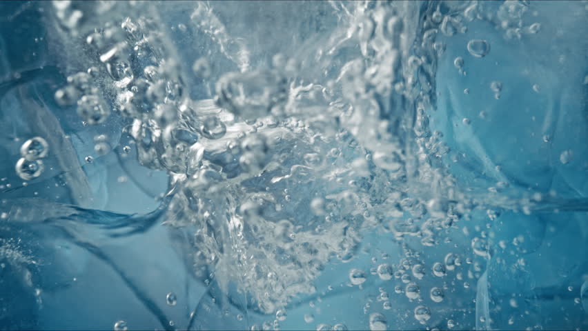 Super Slow Motion Shot of Ice and Air Bubbles in Crystal Clear Water at 1000fps.
