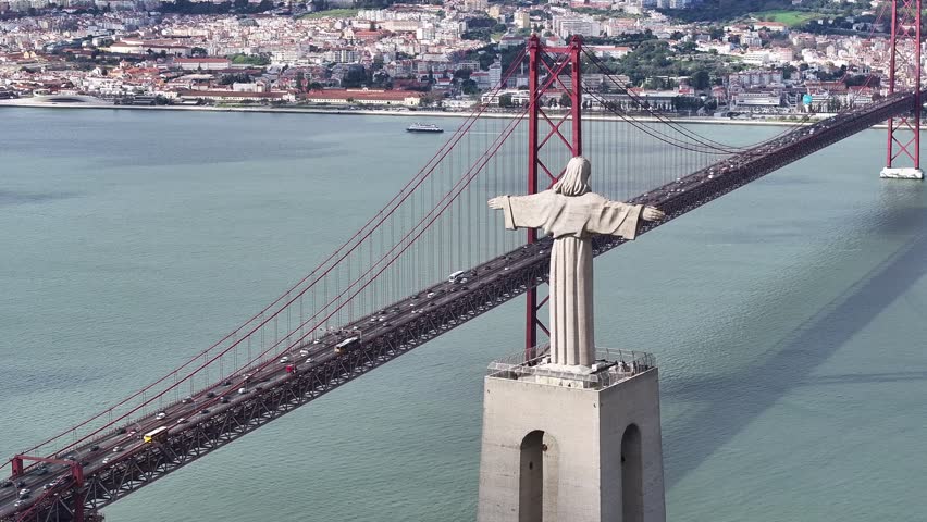 Christ The King At Lisbon In Lisbon District Portugal. King Christ Statue. 25 Of April Bridge. Christ The King At Lisbon In Portugal. Tejo River Coast. Landmark Church. Portugal Skyline.