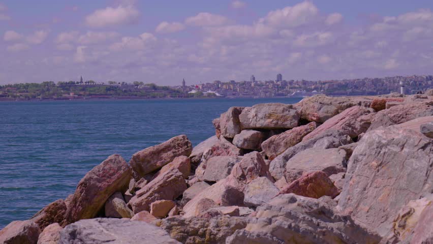 Kadikoy Moda beach cliffs and the Istanbul peninsula in the background