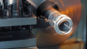 Close-up of turning process on metal lathe machine, Cutting tool shaping spinning cylindrical part in precision machining - Powered by Shutterstock - Get 15% off with code: PIKWIZARD15