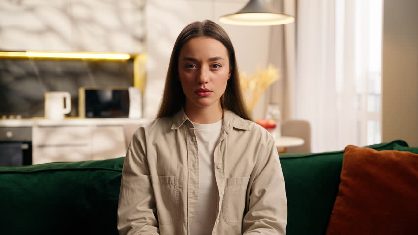 Close up portrait negative dissatisfied Caucasian woman girl holding hand stop no gesture shake head never forbidden sign deny reject European serious female looking at camera at home not palm symbol