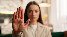 Close up portrait negative dissatisfied Caucasian woman girl holding hand stop no gesture shake head never forbidden sign deny reject European serious female looking at camera at home not palm symbol - Powered by Shutterstock - Get 15% off with code: PIKWIZARD15