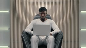 Smiling African American man guy male hacker e-business typing keyboard laptop futuristic cybersecurity coding business online crypto blockchain digital metaverse technology showing thumb up - Powered by Shutterstock - Get 15% off with code: PIKWIZARD15