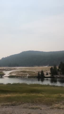 Yellowstone National Park geyser basin steams near Grand Prismatic Spring