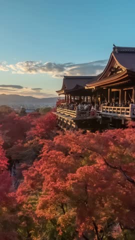 Kyoto Japan time lapse day to night sunset at Kiyomizu dera temple in autumn season (Vertical)