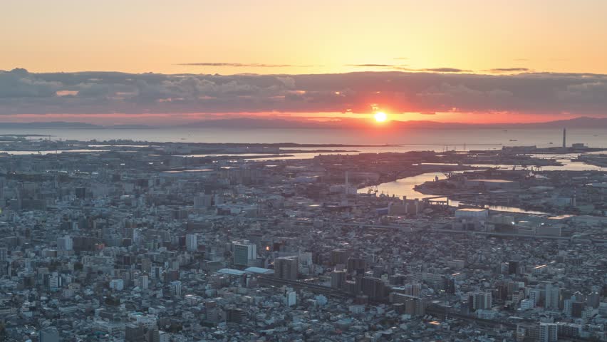 Osaka Japan time lapse city skyline day to night sunset at Osaka harbor port and Kizu river