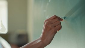 Close up female hand holding chalk writing math exercise on blackboard unrecognizable student girl woman teacher tutor studying learning write formula mathematic in university college school education - Powered by Shutterstock - Get 15% off with code: PIKWIZARD15