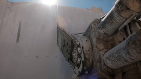 Industrial wire saw cutting through marble block, on marble quarry landscape. Mining concept. - Powered by Shutterstock - Get 15% off with code: PIKWIZARD15
