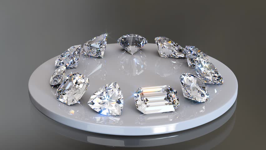 Eleven diamonds of popular cut styles rotating on white porcelain plate on gray background. Seamless loop 3D animation