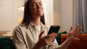 Disappointed stressed upset emotional despair Caucasian woman looking at mobile phone device at home living room failure lose game frustrated female girl with smartphone scam message bet loss error - Powered by Shutterstock - Get 15% off with code: PIKWIZARD15