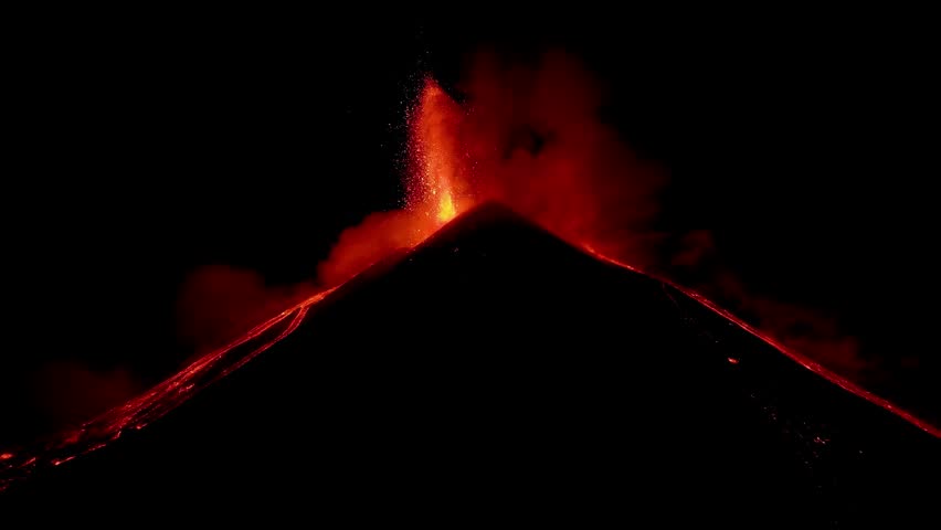 Strombolian activity of May 12, 2025 of the southeast crater of the Etna volcano in Sicily. Lava flows, lapilli explosions. Fire.