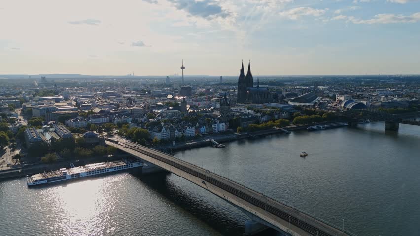 Smooth drone flight toward Cologne Cathedral and central city with Rhine river view