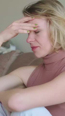 Woman suffering from headache in slow motion