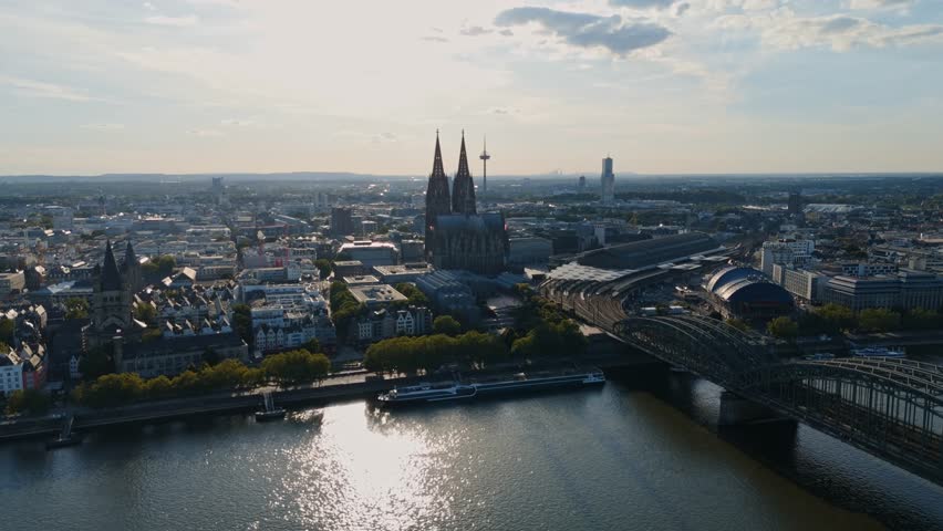 Smooth drone flight toward Cologne Cathedral and central city with Rhine river view