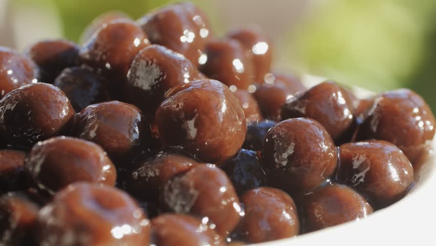 Cooking, boiling brown sugar flavor tapioca pearl balls, chinese food, ingredient of bubble tea, preparing food and drink, close up, recipe cookbook steps design concept.