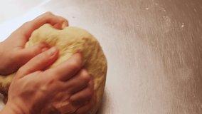 Man making dough Industrial Electric Spiral Dough Mixer Machine Kneading Bread Dough at the Bread Factory.  - Powered by Shutterstock - Get 15% off with code: PIKWIZARD15