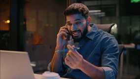 Indian stressed businessman furious business man talking mobile phone in night evening office displeased angry employer discuss problem laptop working overwork stress smartphone call arguing conflict - Powered by Shutterstock - Get 15% off with code: PIKWIZARD15