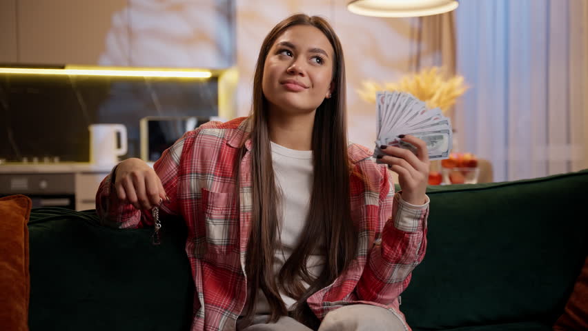 Caucasian rich woman happy girl holding keys new home buying own apartment money investment female real estate agent sell house achieve dollars rent flat buy dwelling success bank credit loan mortgage