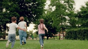 Mother, child, girl, boy, play, run on green lawn in summer park. Family vacation. Happy running children, boy, girl, mother in nature. Weekend with family. Family walks in outdoors in summer. Mom kid - Powered by Shutterstock - Get 15% off with code: PIKWIZARD15