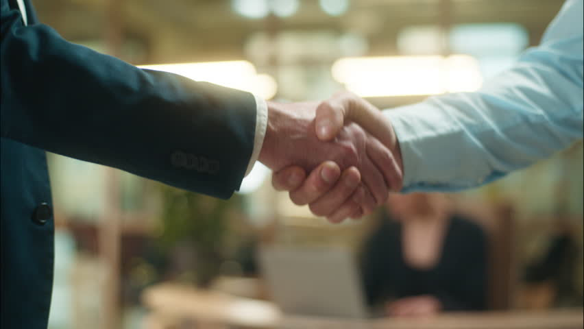 Business men hands handshake close up shaking arms close up guys unrecognizable businessmen welcome greeting in office male partnership handshaking agreement cooperation deal hire candidate recruit - Powered by Shutterstock - Get 15% off with code: PIKWIZARD15