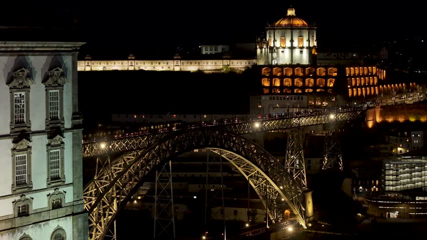 Night Dom Luis I Bridge At Porto In District Of Porto Portugal. City At Night Scene. Illuminated Bridge Landscape. Dom Luis I Bridge At District Of Porto Portugal. Railroad Transport.