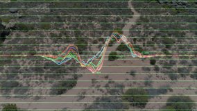 Multicolored waveform graph being projected across desert valley, neon grid overlay tracking data. Tech, data, visualization, digital, futuristic, innovation, analytics - Powered by Shutterstock - Get 15% off with code: PIKWIZARD15