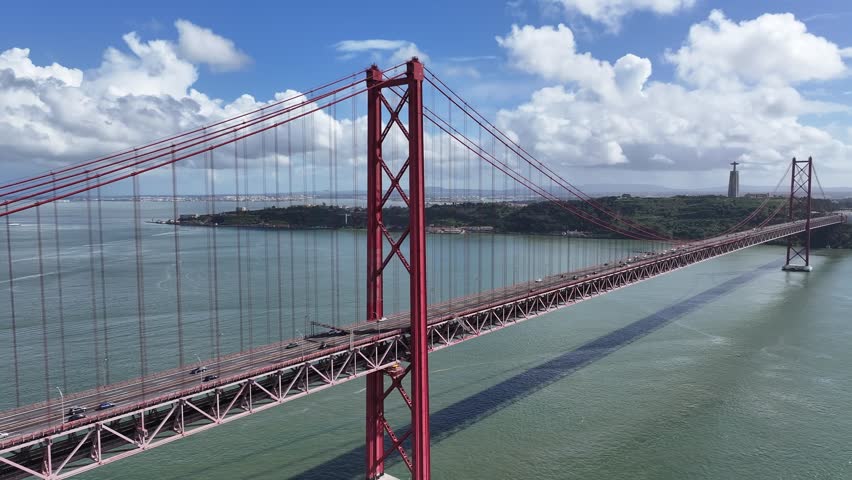 25 Of April Bridge At Lisbon In Lisbon District Portugal. Infrastructure Scenery. Road Trip Transportation. 25 Of April Bridge At Lisbon In Lisbon District Portugal. Famous Cable Stayed Bridge.