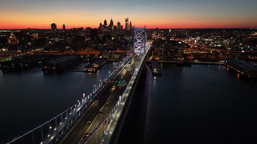 Sunset In Philadelphia Skyline At Philadelphia In Pennsylvania United States. Illuminated Downtown. Sunset City Landscape. Philadelphia At Pennsylvania United States. Ben Franklin Bridge.