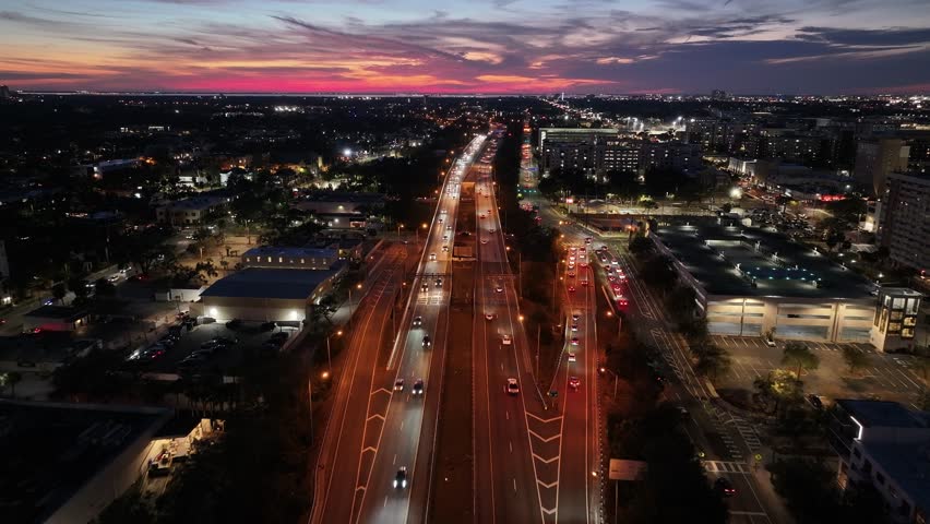 Tampa Skyline At Tampa In Florida United States. Illuminated Highway Road. Traffic Scene. Sunset City Scenery. Florida United States. Tampa Skyline At Tampa In Florida United States.