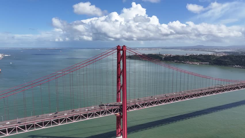 25 Of April Bridge At Lisbon In Lisbon District Portugal. Infrastructure Scenery. Road Trip Transportation. 25 Of April Bridge At Lisbon In Lisbon District Portugal. Famous Cable Stayed Bridge.