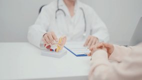 Elderly Patient consulting Doctor to Ear disease. Senior Health Medical Diagnosis. Anatomy Ear model for Atresia, Otitis Media, Pertorated Eardrum, Meniere syndrome, otolaryngologist, Hearing Loss - Powered by Shutterstock - Get 15% off with code: PIKWIZARD15