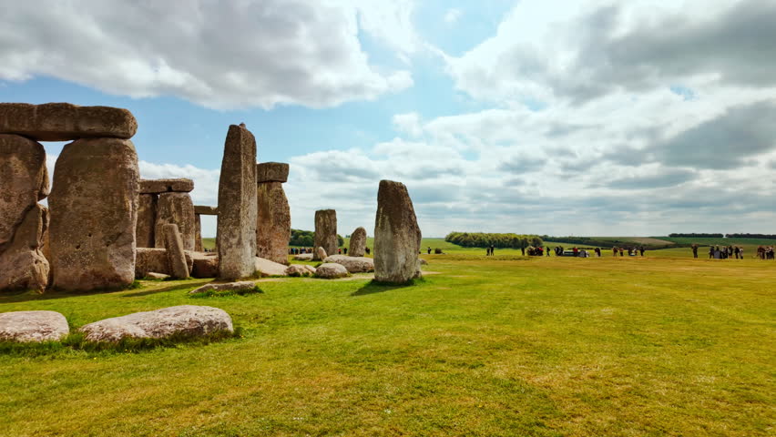 Stonehenge establishing shot showcasing its iconic stone circle composed of towering sarsen pillars, Salisbury, Wiltshire, England, UK
