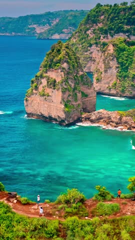 Breathtaking top view on tropical beach Bali with scenery lagoon, sand beach and mountain cliff in ocean on nature background Bali, Indonesia 4K