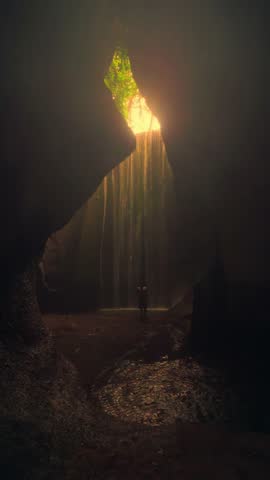 Travel people enjoy wonderful view Tukad Cepung Waterfall Bali famous landmark and popular travel destination Bali, Indonesia 4K