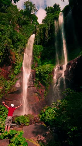 Travel people enjoy beautiful view Sekumpul waterfall Bali famous landmark and popular travel destination Bali, Indonesia 4K 